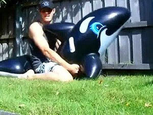 OUTSIDE WITH A POOL TOY