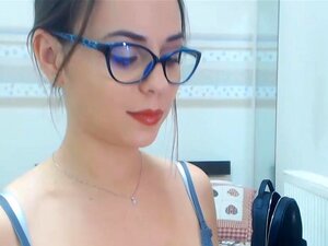 Cam girl is proudly showing off her body and sucking fake cock